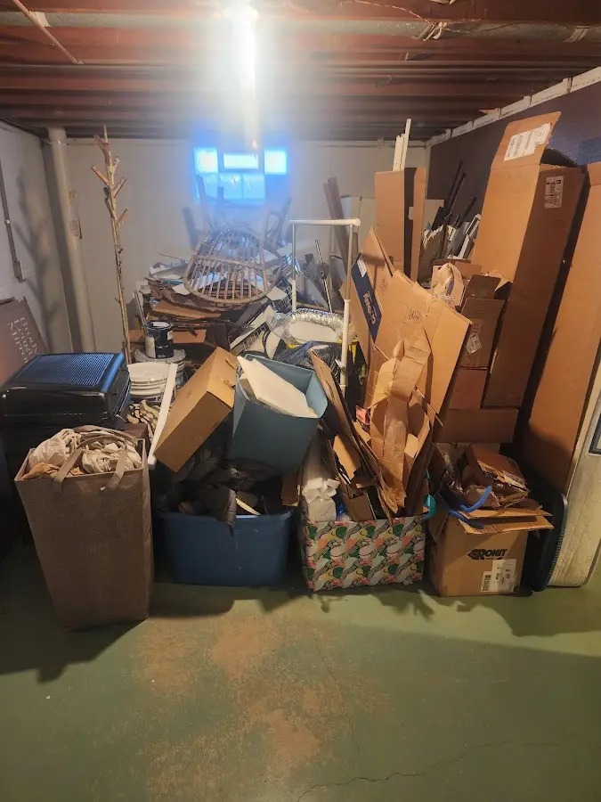 Roll-off dumpster container at job site for 2 Yard Dumpster Rental in Iron Mountain